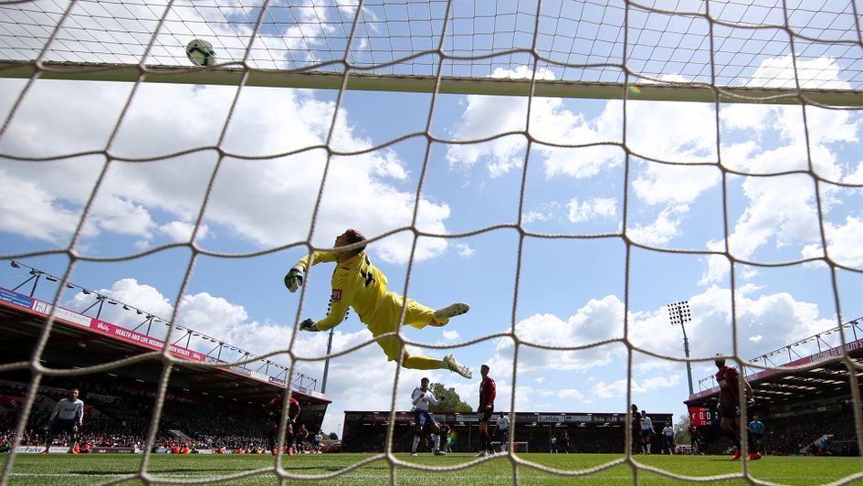 Bournemouth's Mark Travers makes a save on his Premier League debut