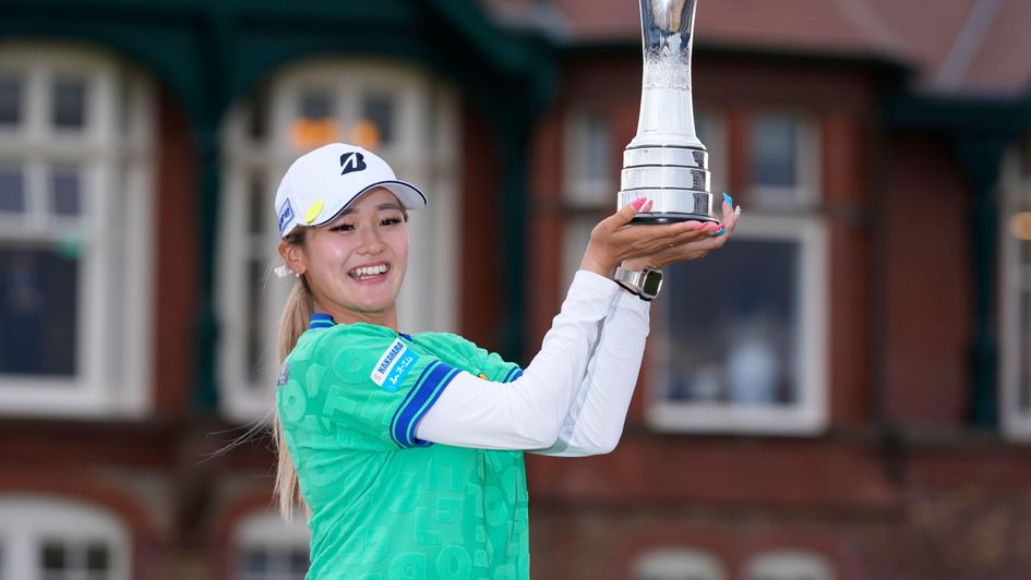 Shiho Kuwaki of Japan celebrates with the trophy