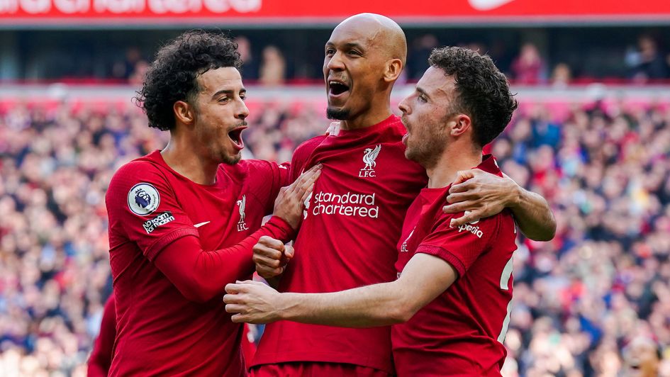 Curtis Jones celebrates with Fabinho and Diogo Jota