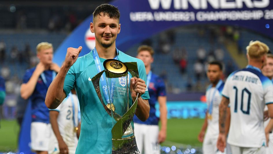 England's goalkeeper James Trafford celebrates with the trophy