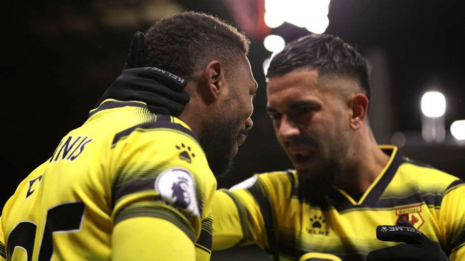 Emmanuel Dennis celebrates with teammate Imran Louza