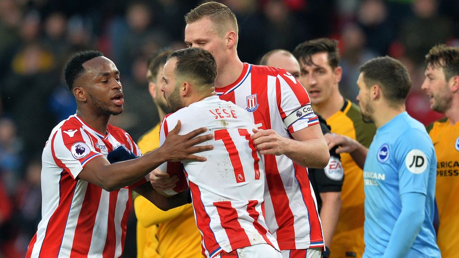 Jese Rodriguez argues with his Stoke City teammates over who will take a penalty against Brighton