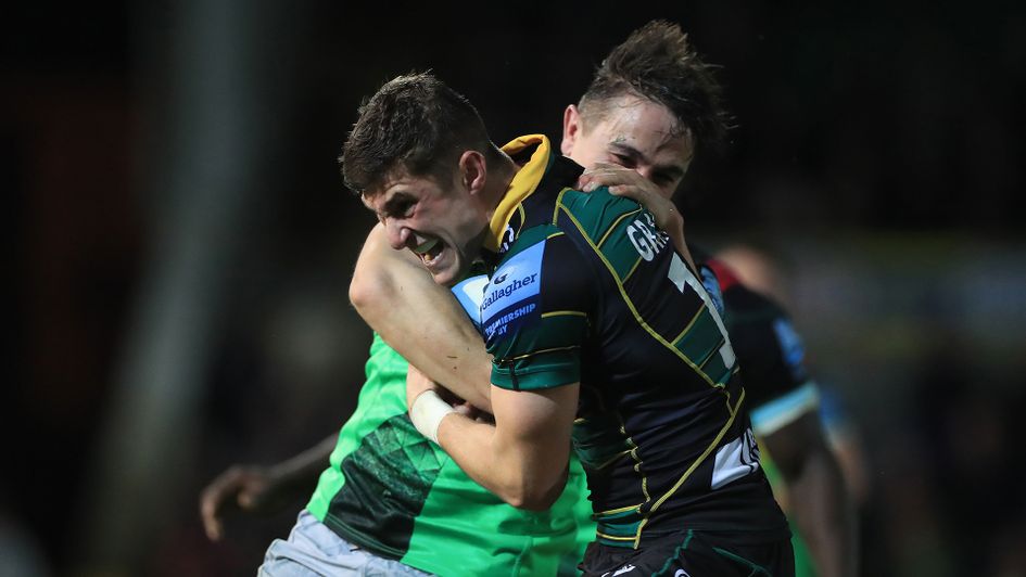 Northampton Saints' James Grayson is tackled by Harlequins' Caden Murley