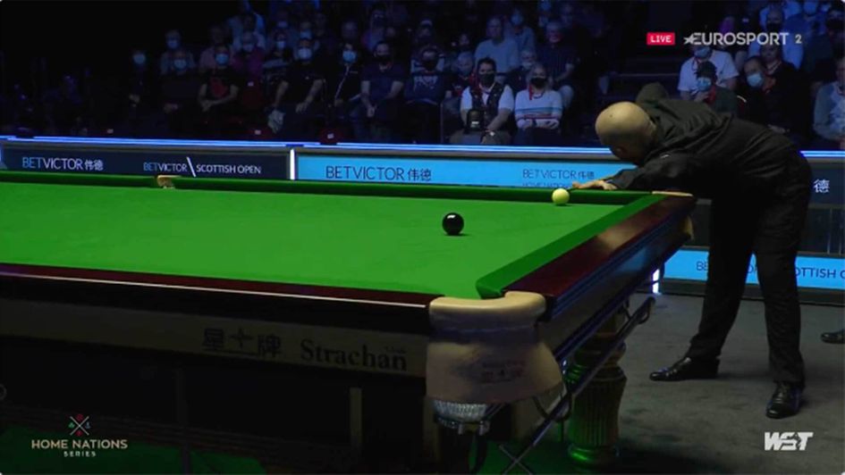 Luca Brecel plays a no look shot as he wins the Scottish Open