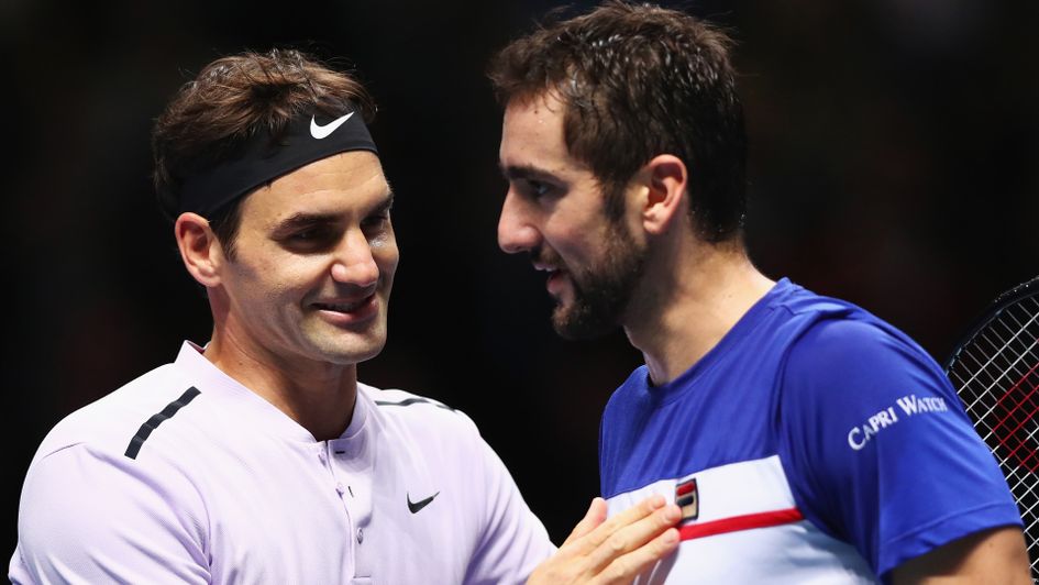 Roger Federer (l) is congratulated by Marin Cilic