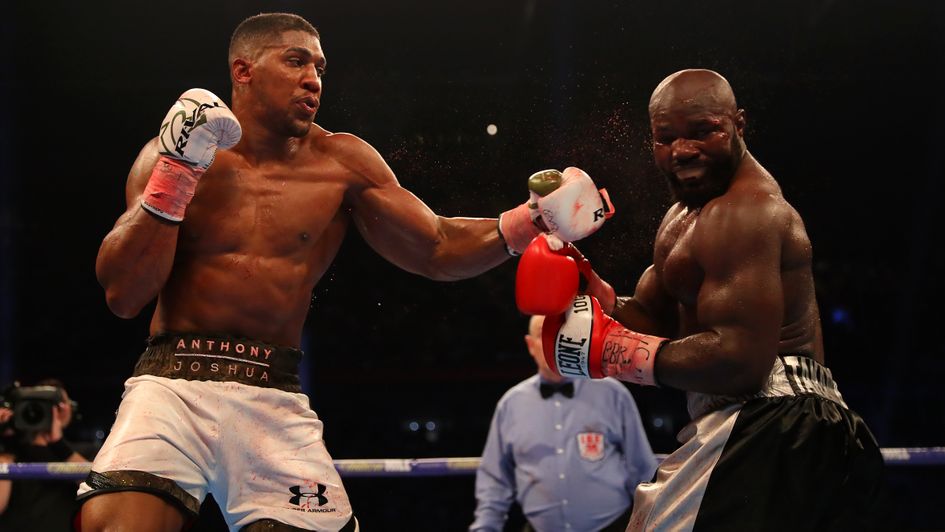 Joshua lands a left hook on Takam