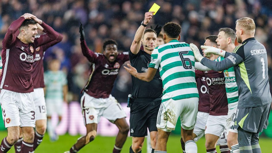 Auston Trusty is shown a yellow card