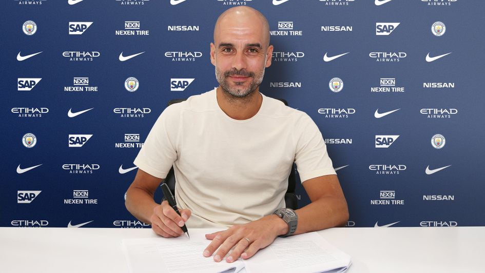 Pep Guardiola signs his new Manchester City contract
