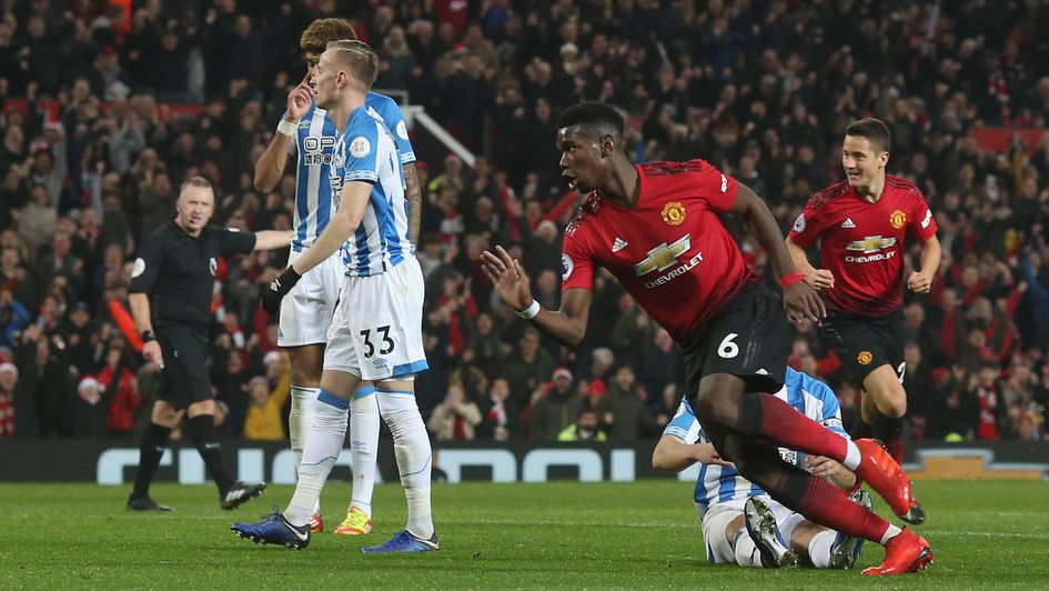 Paul Pogba celebrates after scoring for Manchester United against Huddersfield