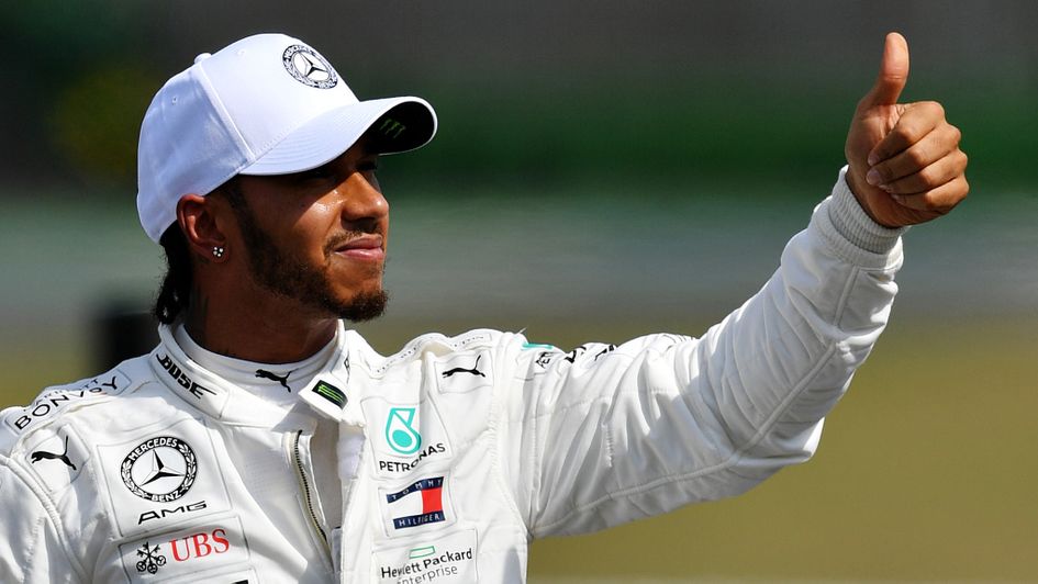 Lewis Hamilton: Mercedes driver gives the thumbs up after claiming pole position at the German GP