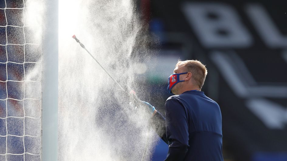 The goal posts are disinfected at Selhurst Park