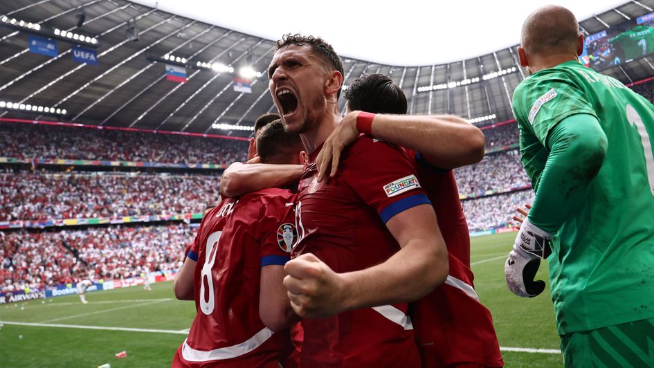 Luka Jovic of Serbia (L) celebrates scoring the 1-1 goal with his teammates during the UEFA EURO 2024 Group C soccer match between Slovenia and Serbia
