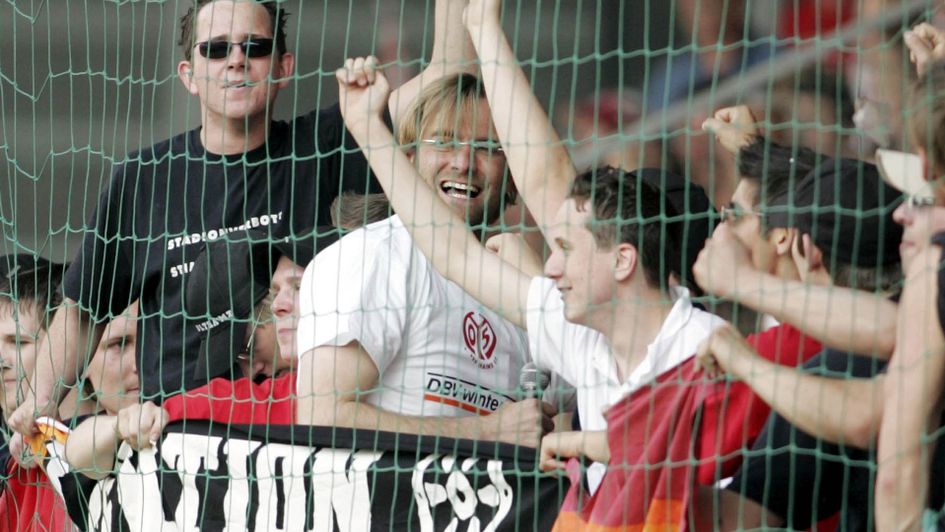 Jurgen Klopp celebrates in with the fans during his time at Mainz
