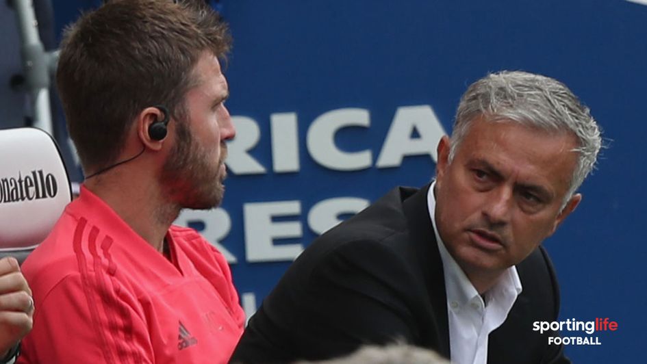 Jose Mourinho in discussion with Michael Carrick