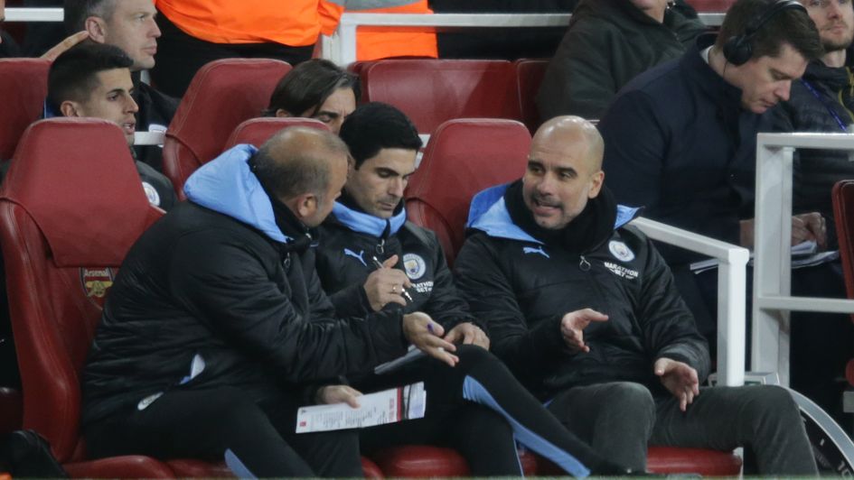 Mikel Arteta and Pep Guardiola of Manchester City during their match at Arsenal