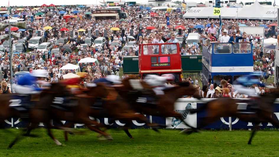Huge crowds watch the action at Epsom on Derby day