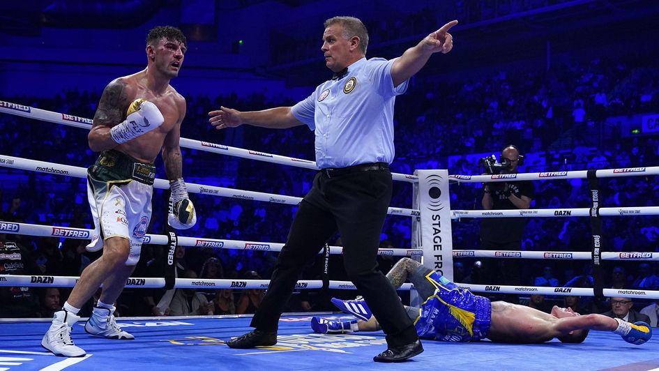Leigh Wood (left) reacts after knocking down Josh Warrington