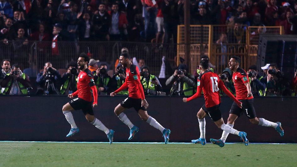 Egypt players celebrate their opening goal against Senegal