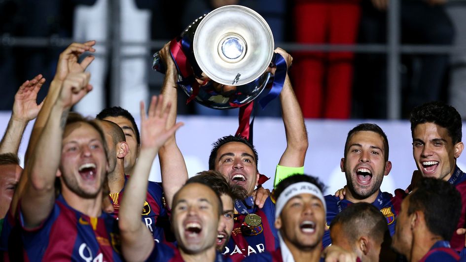 Xavi lifts the Champions League trophy