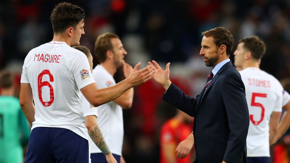 Gareth Southgate (right) shakes hands with Harry Maguire (left) after England's defeat to Spain