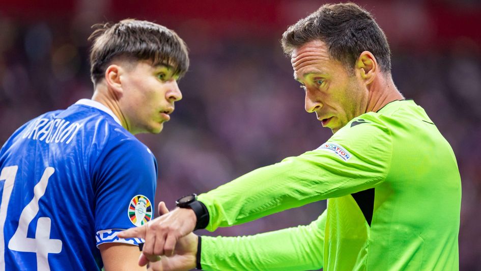 Artur Craciun getting a talking too by the referee in Moldova's match against Poland