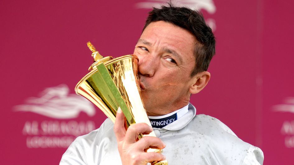 Frankie Dettori kisses the Lockinge Stakes trophy