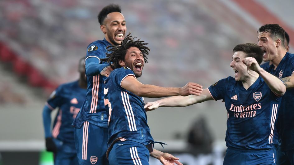Mohamed Elneny of Arsenal celebrates with team mates Kieran Tierney and Pierre-Emerick Aubameyang