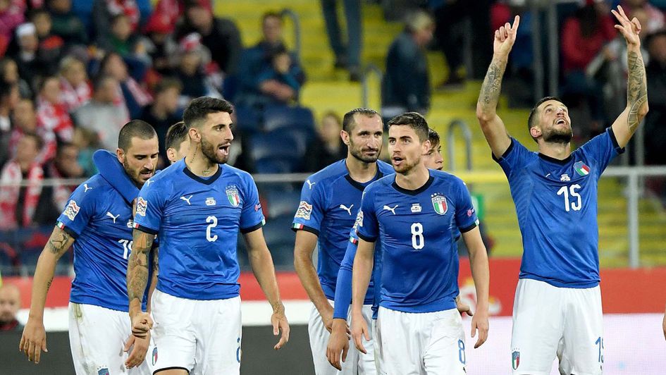 Italy celebrate their last minute winner in Poland