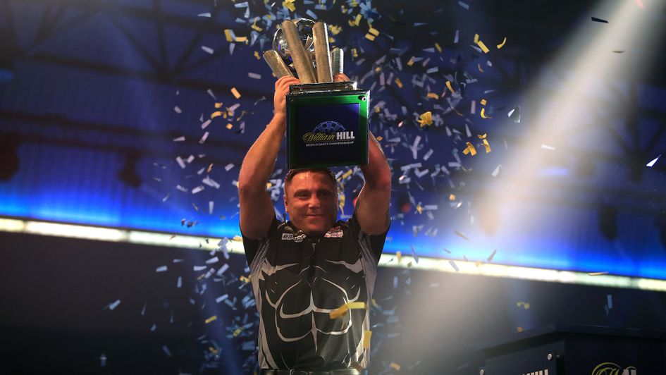 Gerwyn Price lifts the Sid Waddell Trophy after become PDC world champion