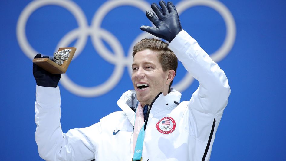 Shaun White celebrates with his gold medal