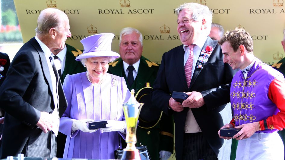 Her Majesty The Queen pictured with Sir Michael Stoute and Ryan Moore