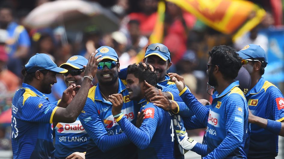 Wanidu Hasaranga celebrates his hat-trick