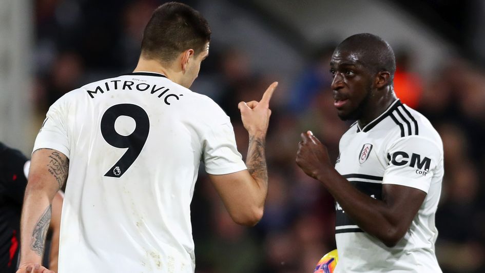 Aboubakar Kamara argues with Aleksandar Mitrovic over the penalty