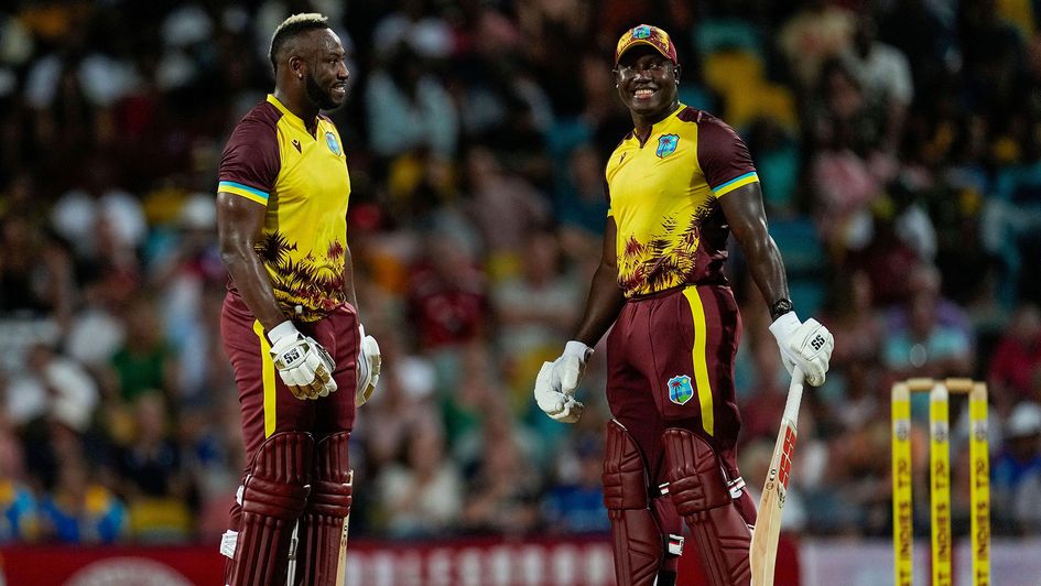 West Indies' batsmen Andre Russell, left, and Rovman Powell celebrate