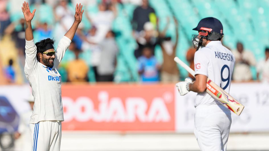 India's Ravindra Jadeja, left, celebrates as England's James Anderson looks on