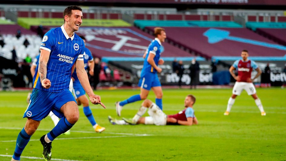 Brighton's Lewis Dunk celebrates scoring against West Ham