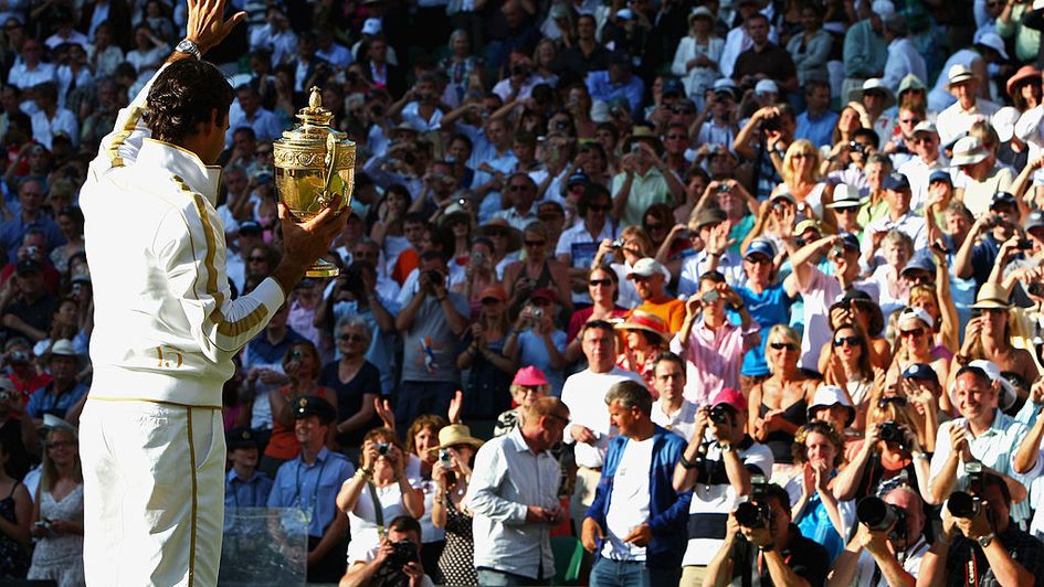 Roger Federer with the Wimbledon trophy