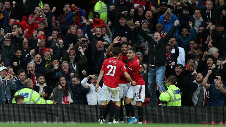 Manchester United celebrate Marcus Rashford's goal against Liverpool