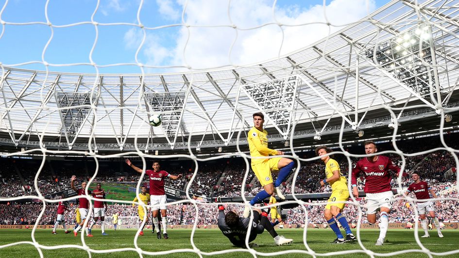 West Ham goalkeeper Lukasz Fabianski stops Chelsea's Alvaro Morata from scoring