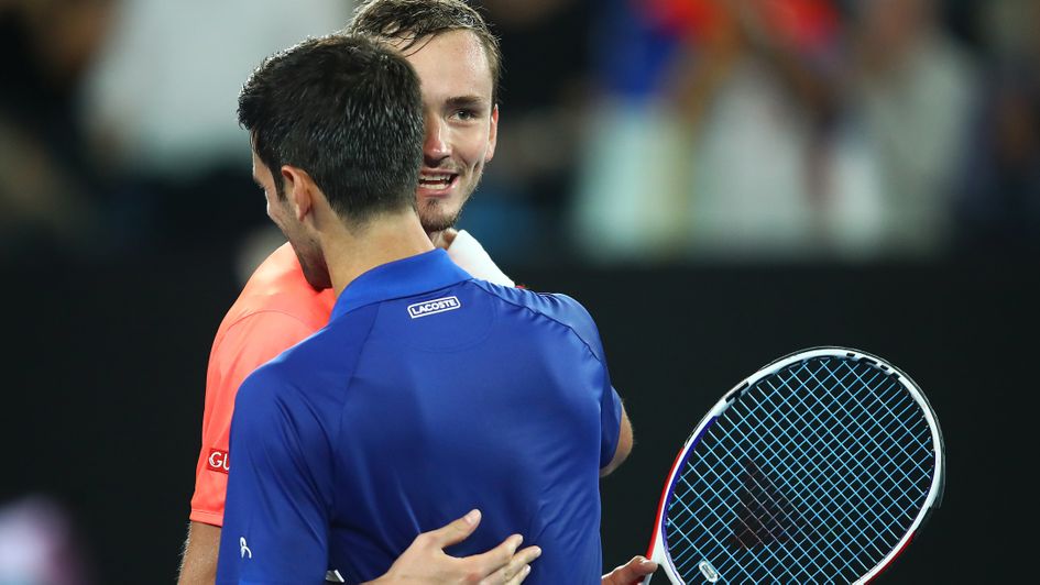 Novak Djokovic and Daniil Medvedev embrace