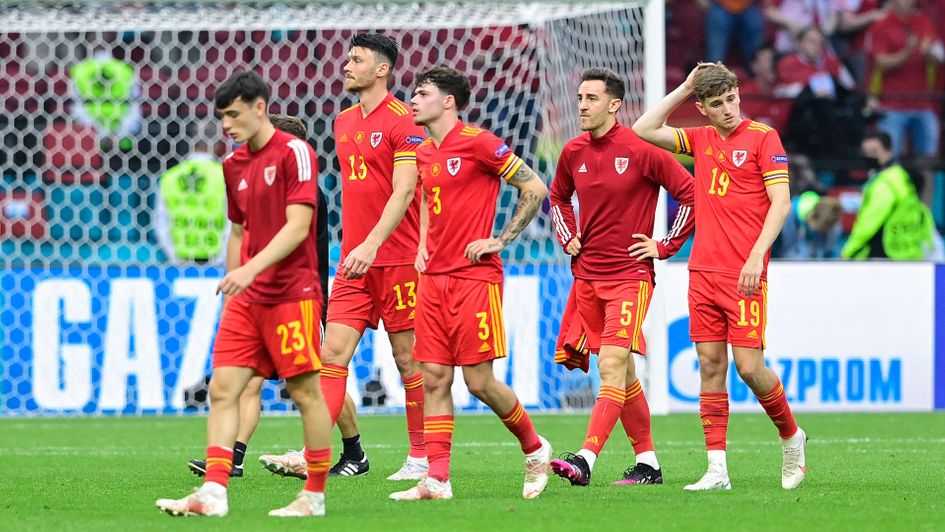 Wales leave the pitch after defeat to Denmark