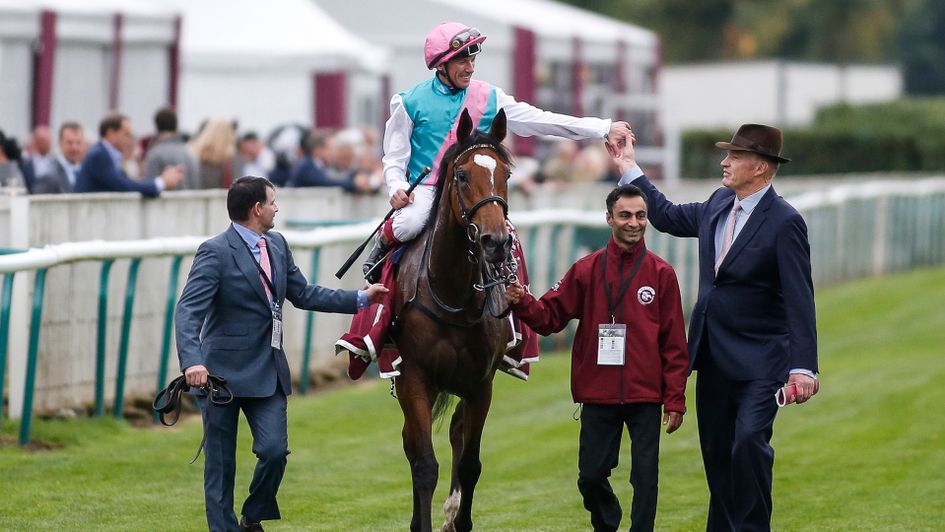 John Gosden congratulates Frankie Dettori after he partnered Enable to victory in the Arc
