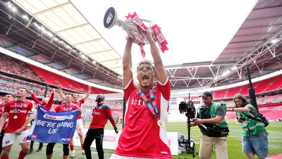 Lyle Taylor with the Sky Bet League One play-off trophy