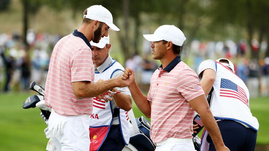 Dustin Johnson and Brooks Koepka celebrate