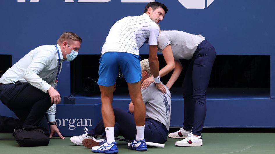 Novak Djokovic: Serbian tends to line judge after hitting them with a ball - which saw him disqualified from US Open