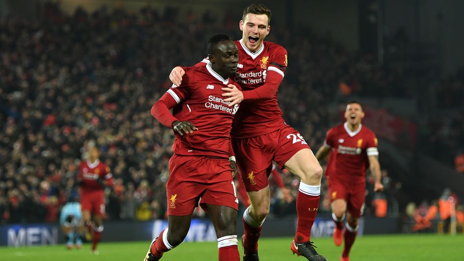 Andy Robertson celebrates with Sadio Mane
