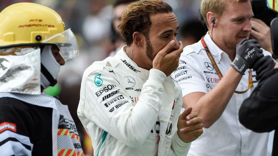 Lewis Hamilton reacts to winning his fifth world title