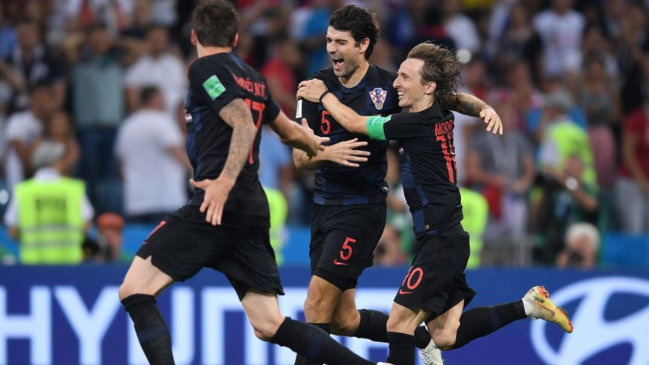 Vedran Corluka, Luka Modric and Mario Mandzukic celebrate after victory over Russia