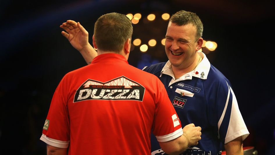 Glen Durrant and Mark McGeeney embrace after a thrilling final