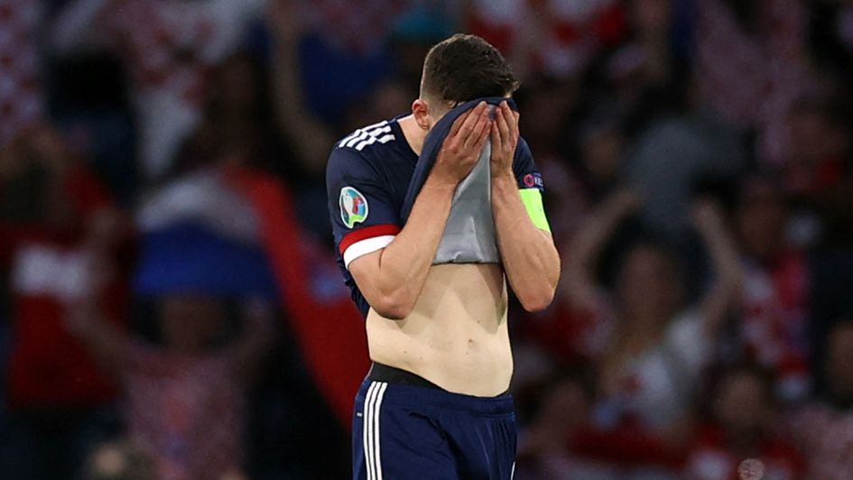 Andy Robertson reacts after Croatia's third goal